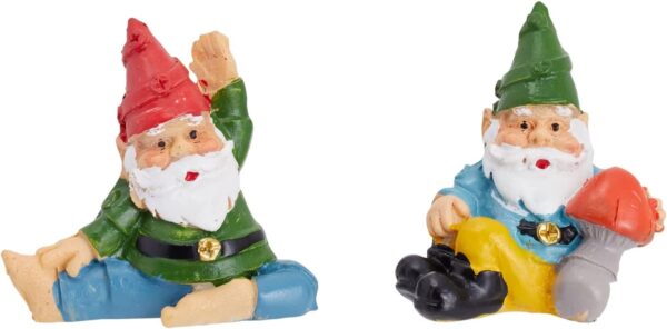 Two miniature garden gnome figurines, one sitting with a red hat and green shirt, and the other holding a mushroom with a green hat and blue shirt.