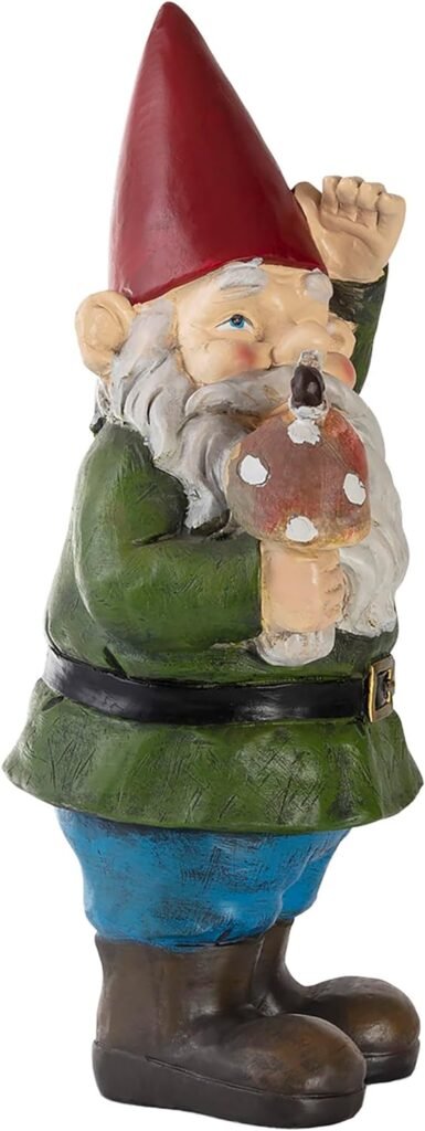 Garden gnome statue with a red hat, green coat, blue pants, brown boots, holding a red and white mushroom.